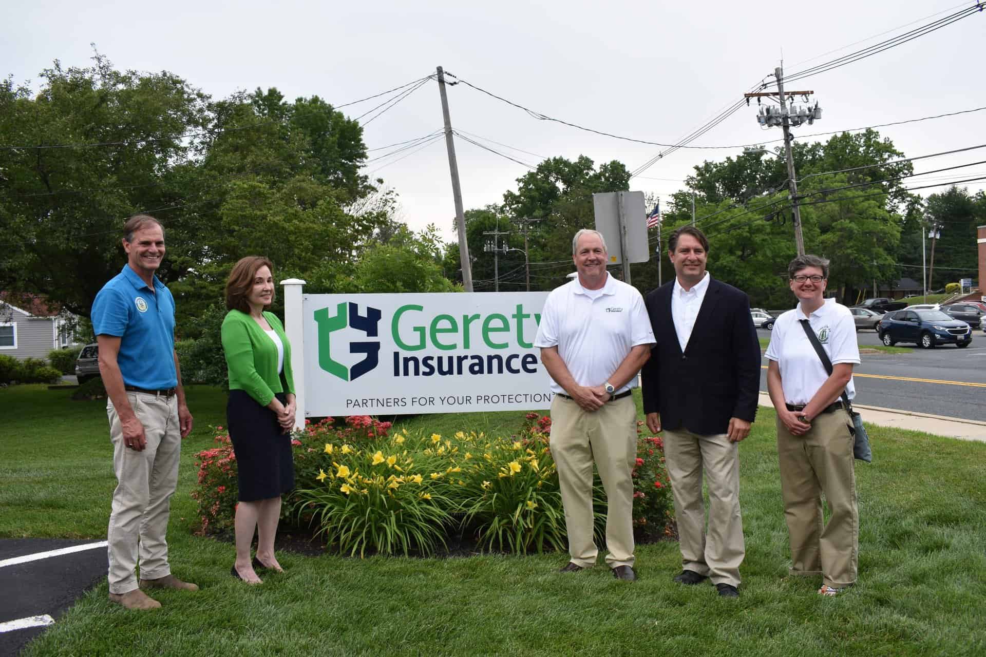 Five people standing by a Gerety Insurance sign