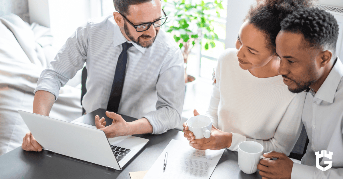 Insurance agent explaining the difference between brokers and carriers to a couple