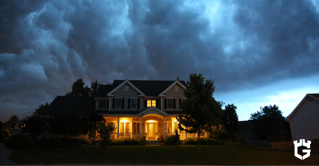 Dark storm clouds over a house, representing water backup risk